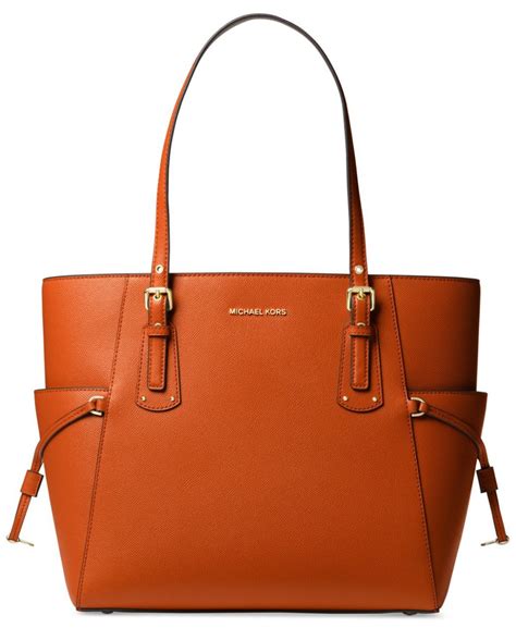 michael kors voyager east west tote burnt orange|Michael Kors voyager signature tote.